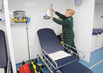 Paramedic at work inside the mobile treatment centre